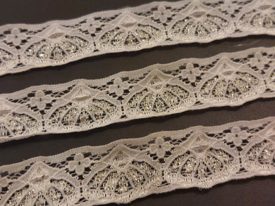 10 METRE PACK OF WHITE FLAT LACE WITH SILVER LUREX SHELL DESIGN - APPROX ONE INCH WIDE