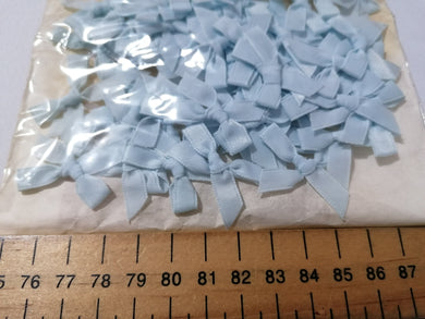 PACK OF APPROX 20 BLUE RIBBON BOWS - APPROX 3cm WIDE